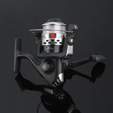 Fishing reel with metallic finish on a reflective black surface