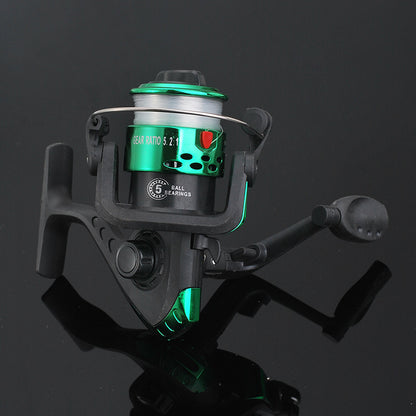 Fishing reel with green accents on a black background