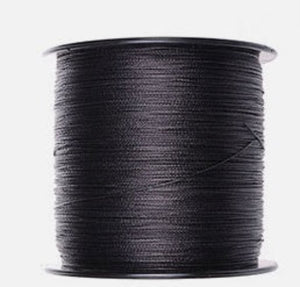 Spool of yellow thread on a white background