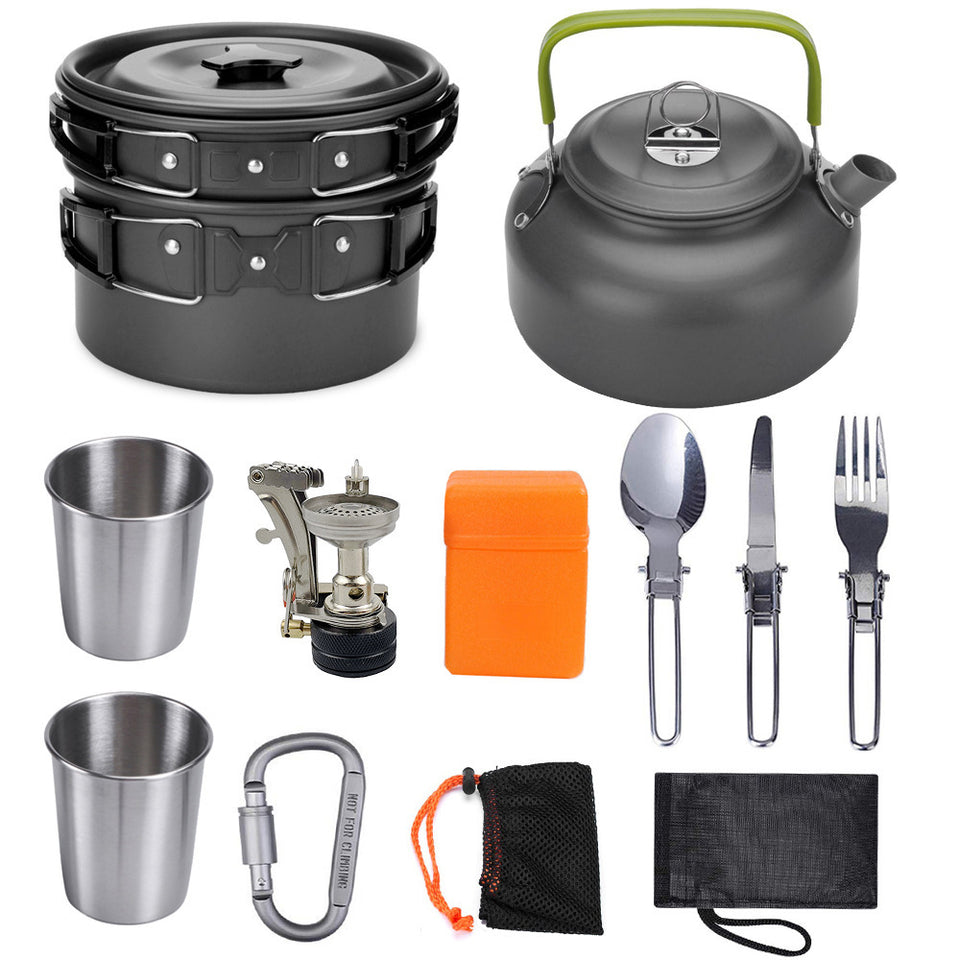 Collection of camping and outdoor cooking equipment including pots, kettle, cups, utensils, and carabiner on a white background.