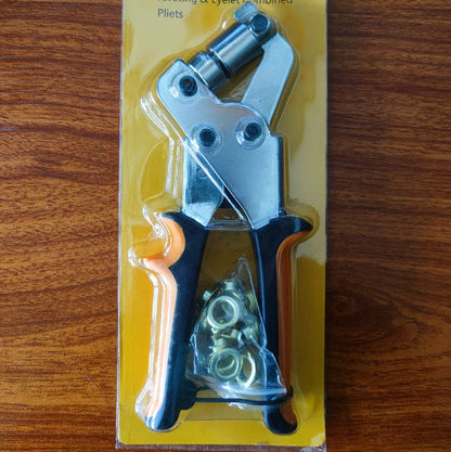 Riveting and eyelet combined pliers in packaging on a wooden surface