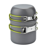 Gray camping cookware set with green handles on a white background