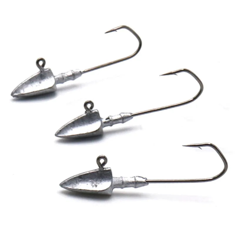Three metal fishing jigs on a white background