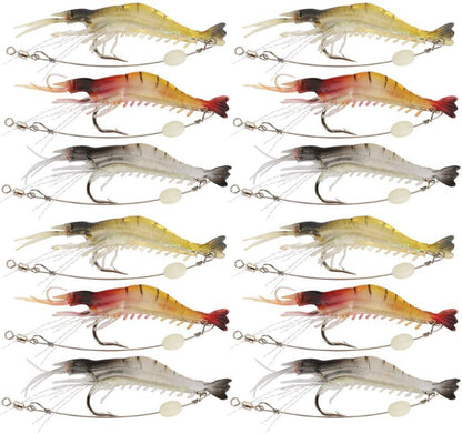 Twelve fishing shrimp lures arranged in a 4-by-3 grid on a plain white background. The lures vary in color between yellow, red, orange, and gray, each with a treble hook and split bead tail.