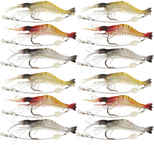 Twelve fishing shrimp lures arranged in a 4-by-3 grid on a plain white background. The lures vary in color between yellow, red, orange, and gray, each with a treble hook and split bead tail.