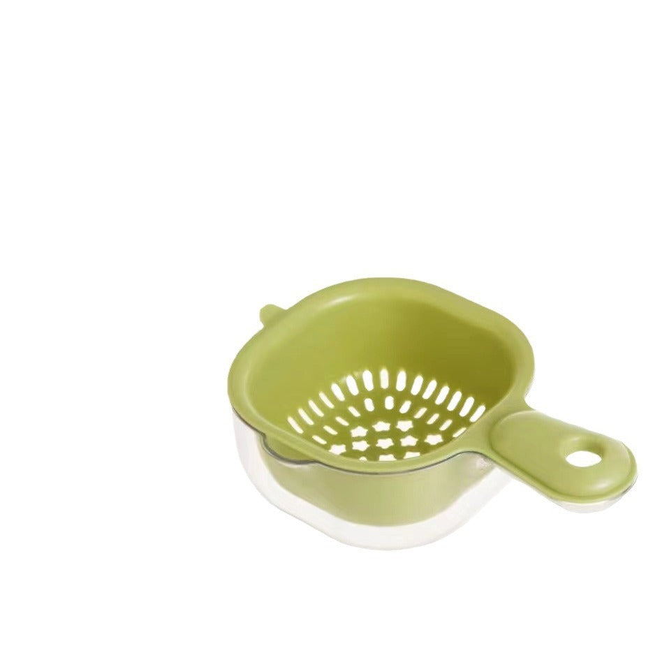 Green kitchen strainer on a white background