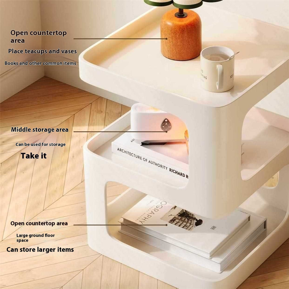 White storage unit with labeled open countertop, middle storage, and open ground floor space on a wooden floor.