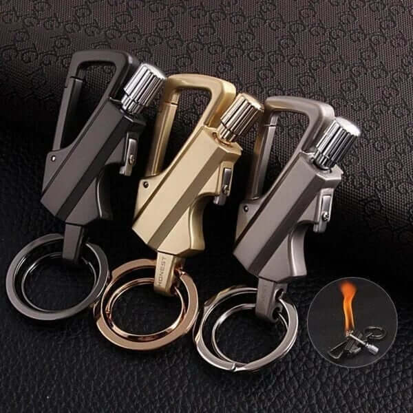 FIRE MATE Three keychain lighters in black, gold, and silver on a textured dark background.