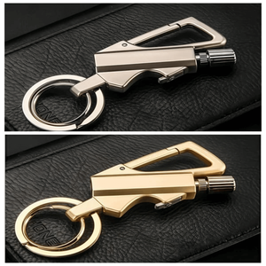 FireMate™ Metal keychain with carabiner and tool on a black leather surface
