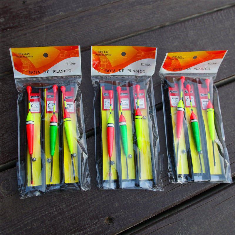 Foam storage for fishing lures and hooks on a wooden surface.