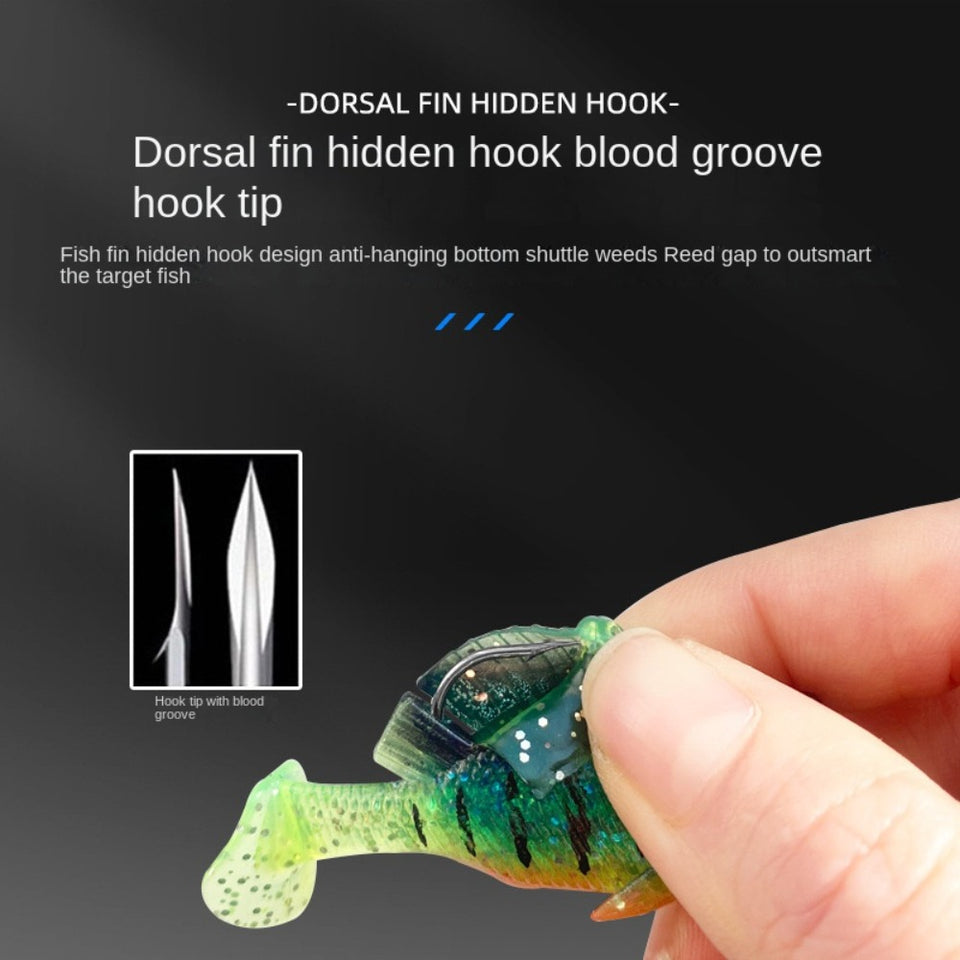 Close-up of a hand holding a fishing lure with text explaining the dorsal fin hidden hook feature.