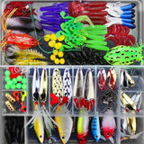 Assorted fishing lures and accessories in a clear organizer box.